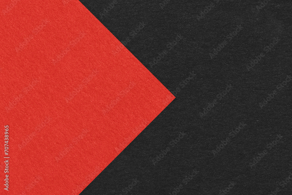Texture of black paper background, half two colors with red arrow, macro. Structure of dense craft cardboard. stock photo Texture of black paper background, half two colors with red arrow, macro. Structure of dense craft cardboard. stock photo