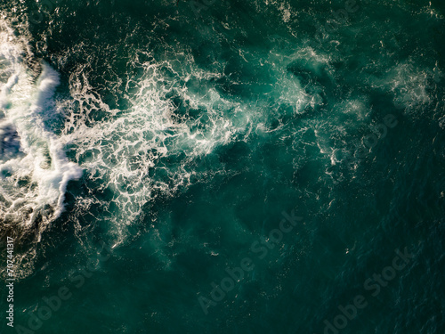 Aerial view of Waves crashing on seashore,Sea surface ocean waves background