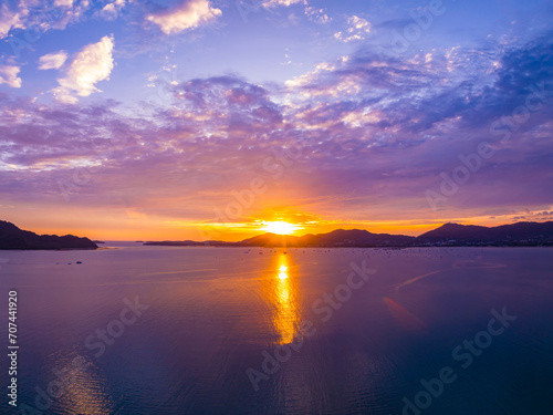 Aerial view sunset sky, Beautiful Light Sunset or sunrise over sea,Colorful dramatic majestic scenery sunset Sky, Amazing clouds and small waves in the ocean, Wonderful light cloud background © panya99