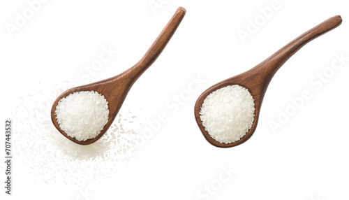 Shredded coconut in the wooden spoon, isolated on white background, top view.
