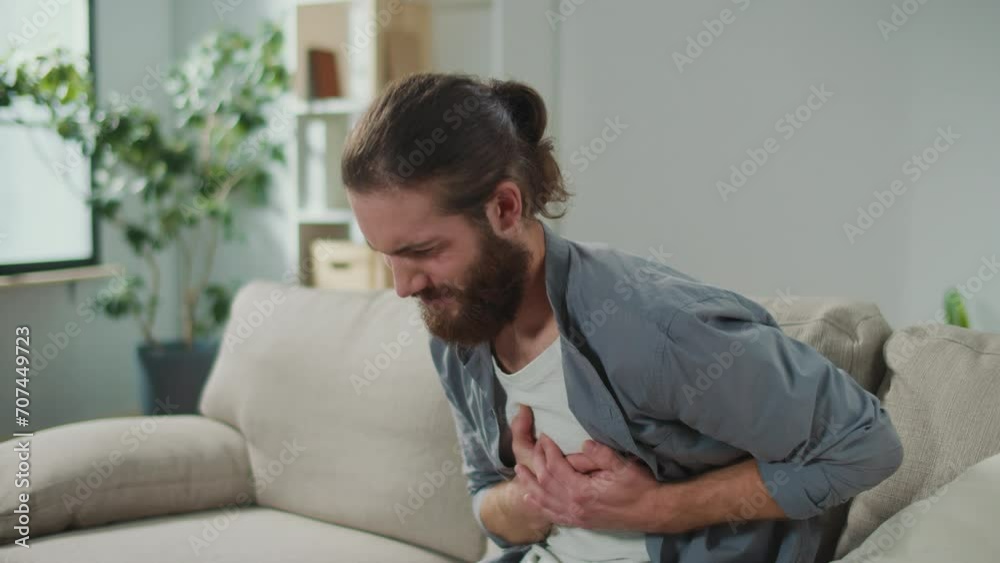 Man has Got the Symptoms of Heart Attack. Breathing Problems, Chest Pain. has Difficulty Breathing, Hand Touches Chest. Heart Attack, Thoracic Osteochondrosis, Panic Attack Man has Got the Symptoms of Heart Attack. Breathing Problems, Chest Pain. has Difficulty Breathing, Hand Touches Chest. Heart Attack, Thoracic Osteochondrosis, Panic Attack