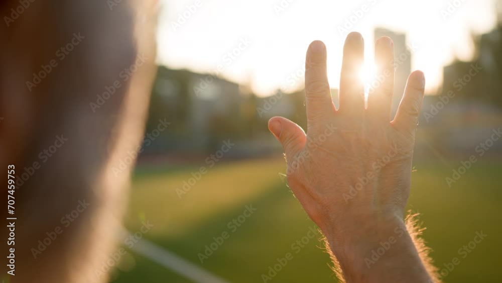 Old man grandfather pensioner looking sunrise sun through palm hand morning close up unrecognizable male stadium city outside physical activity wellbeing healthcare bodycare warm relax freedom nature Old man grandfather pensioner looking sunrise sun through palm hand morning close up unrecognizable male stadium city outside physical activity wellbeing healthcare bodycare warm relax freedom nature