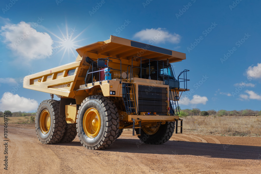 diamond mine truck driving on a dirt road in the scorching sun