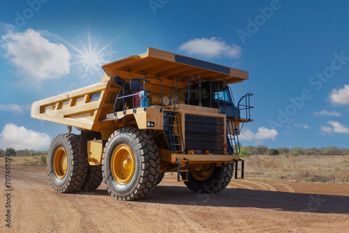 diamond mine truck driving on a dirt road in the scorching sun