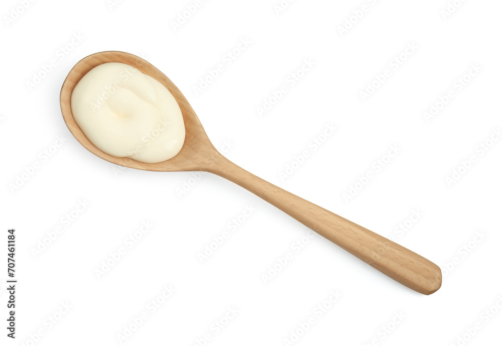 Fresh mayonnaise sauce in wooden spoon isolated on white, top view Fresh mayonnaise sauce in wooden spoon isolated on white, top view