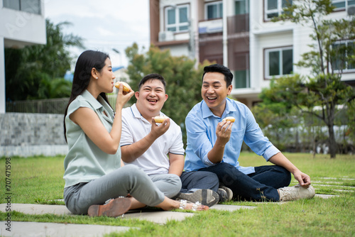 Asian attractive family, parents playing with young son in the garden.