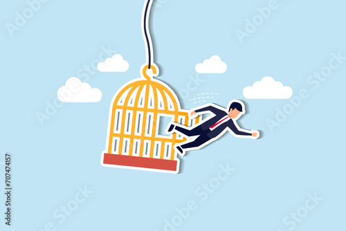 Courage to escape for freedom, get out of comfort zone to find new job, open mind or fly away for better life, hope and liberty concept, courage businessman escape from bird cage jump and fly away. photo