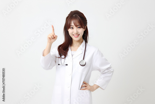a young female doctor showing thumbs up sign isolated on a white background