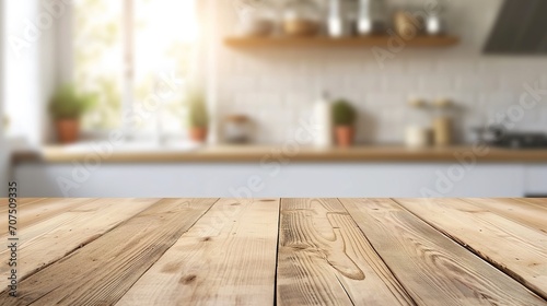 Empty beautiful wood table top counter and blur bokeh modern kitchen interior background in clean and bright photo