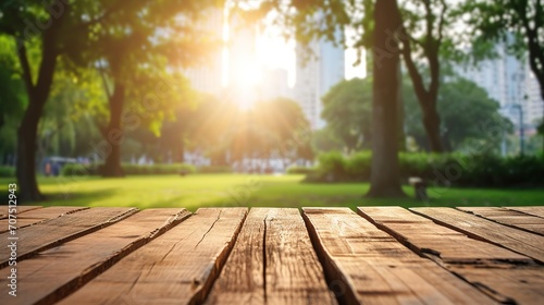 Empty wooden table with blurred city park on background, flare light background