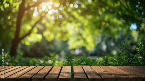 Nature background, Wood table for food and product display over blur green tree garden, Blue park nature outdoor and wood table with bokeh light background in spring and summer