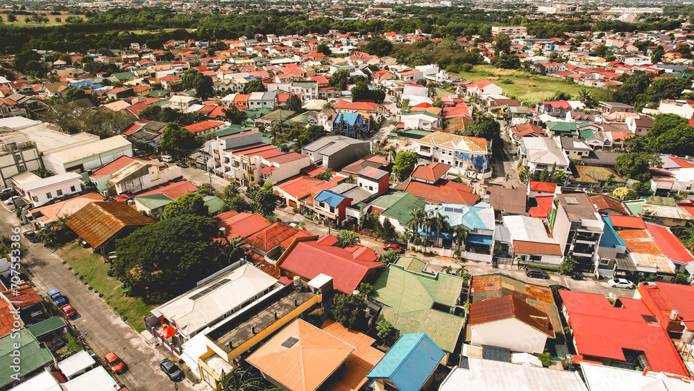 Aerial of typical houses and streets in a middle-class gated subdivision in Las Pinas, Metro Manila.