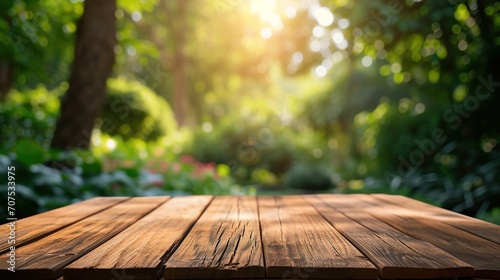 Wooden table in garden and summer time. Free space for your decoration photo