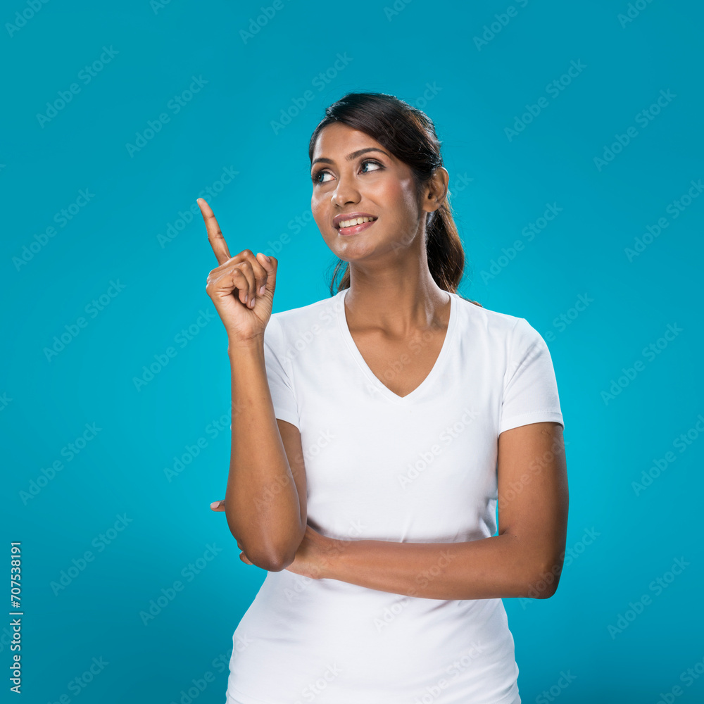 Portrait of happy Indian Woman pointing at something. Portrait of happy Indian Woman pointing at something.