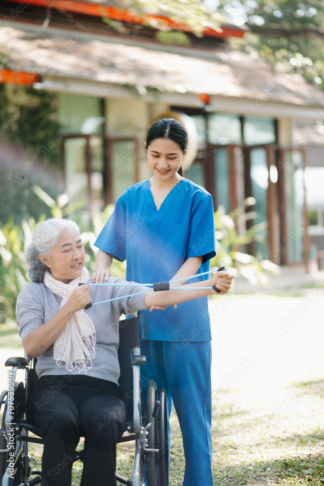 Elderly asian senior woman on wheelchair with Asian careful caregiver and encourage patient, walking in garden. with care from a caregiver and senior health insurance.
Elderly asian senior woman on wheelchair with Asian careful caregiver and encourage patient, walking in garden. with care from a caregiver and senior health insurance.