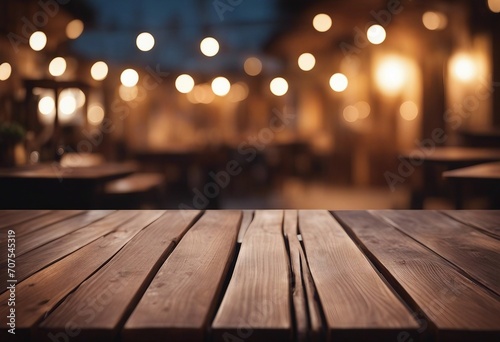 Empty wooden table and bokeh lights blurred outdoor cafe background High quality photo © ArtisticLens
