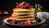 A stack of delicious pancakes with fruit on top