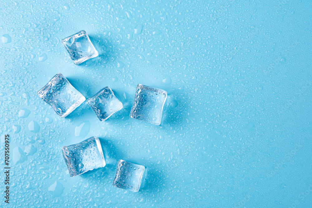 Ice cubes with water drops on a blue background. Ice cubes with water drops on a blue background.