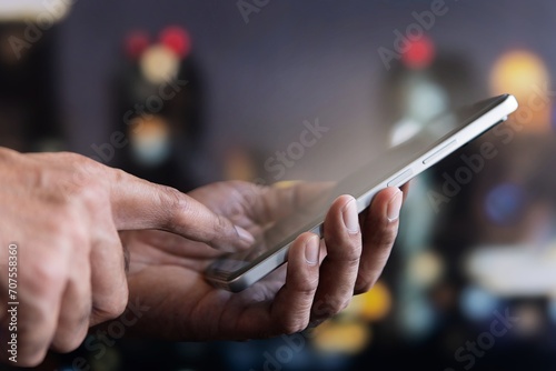 Closeup image of hand using smartphone. Technology concept