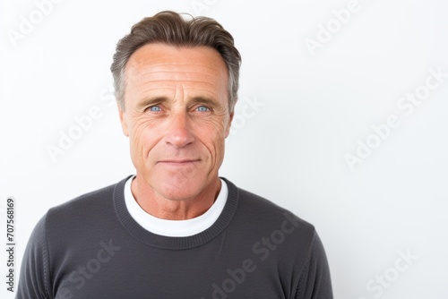 Portrait of handsome mature man looking at camera. Isolated on white background.
