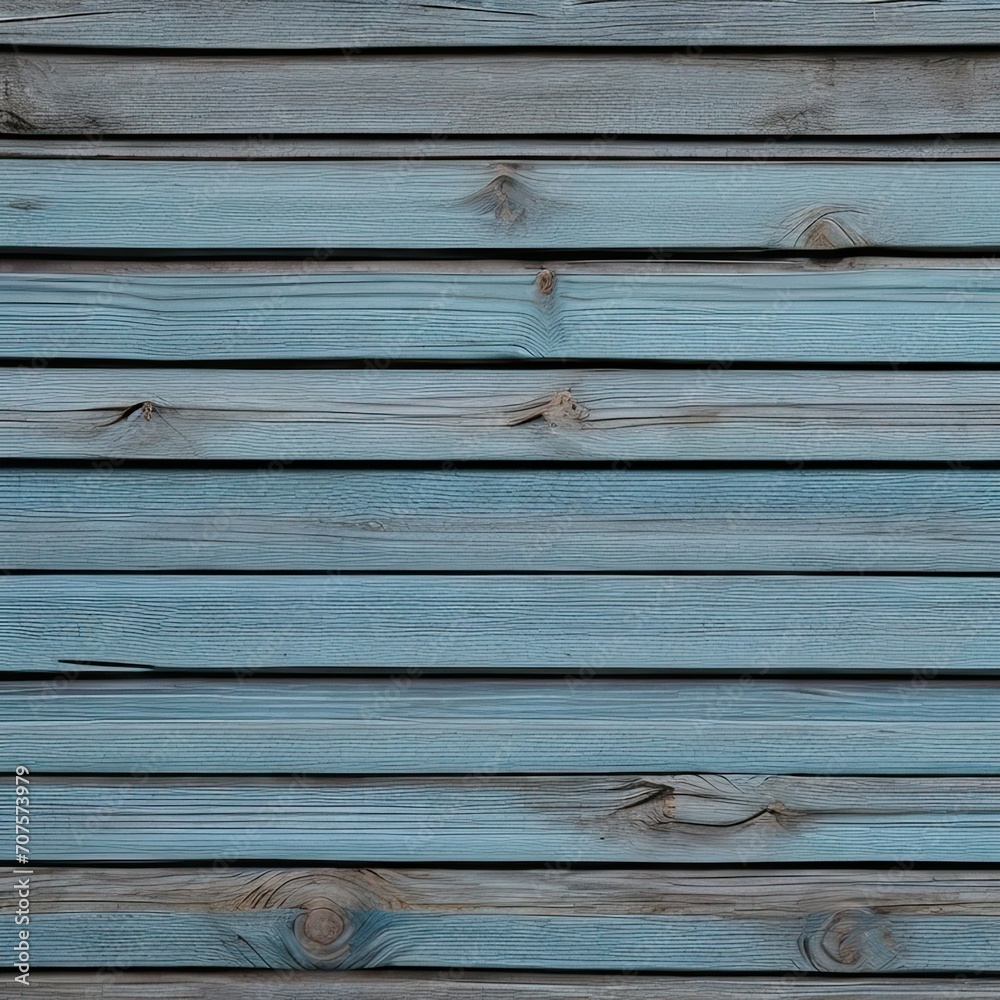 Obraz premium Fragment of an old wall made of wooden planks. There is a color gradient from faded blue to gray. Background. Texture