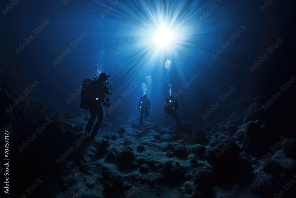 Moonlit Night Dive: Divers exploring the mysteries of the ocean under a moonlit sky. Moonlit Night Dive: Divers exploring the mysteries of the ocean under a moonlit sky.