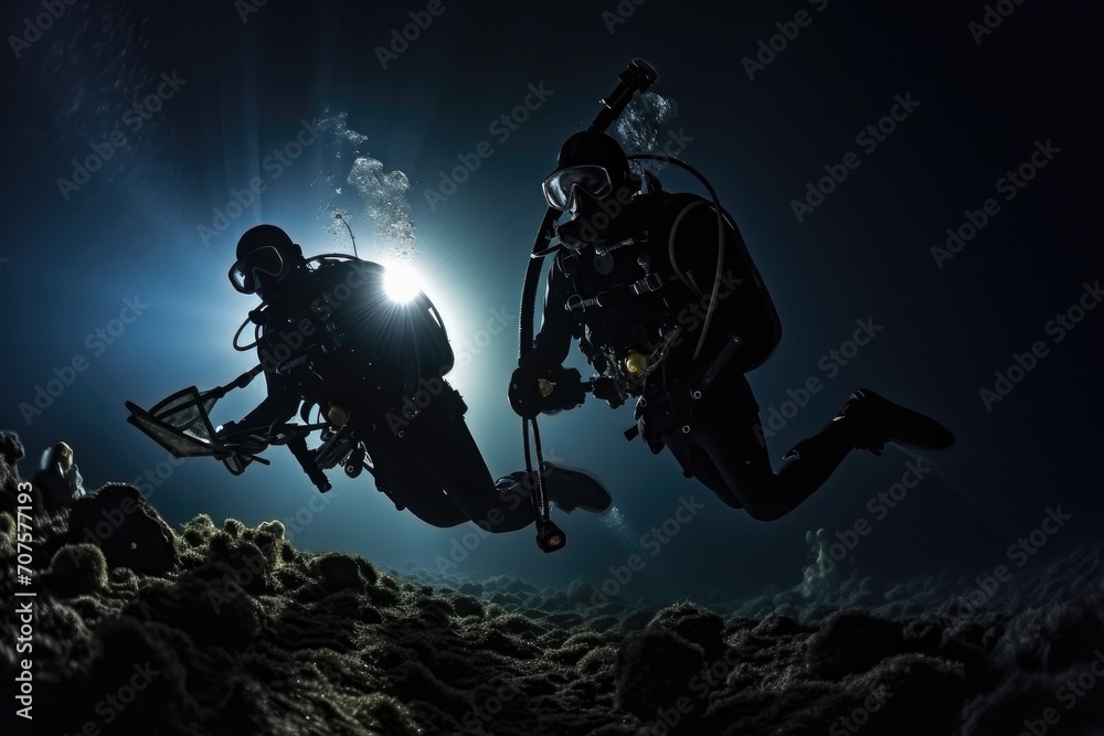 Moonlit Night Dive: Divers exploring the mysteries of the ocean under a moonlit sky.