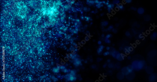 Blurred blue abstract background of bokeh and small round particles of energy magical holiday flying dots on a black background