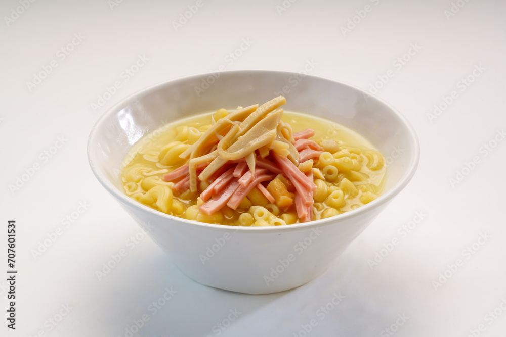 Imitation abalone and ham pasta served in bowl isolated on wooden table side view of hong kong fast food Imitation abalone and ham pasta served in bowl isolated on wooden table side view of hong kong fast food