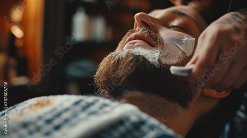 Obraz na plátně Revitalizing and Refreshing: Barber Applying Aftershave to Client's Freshly Shav