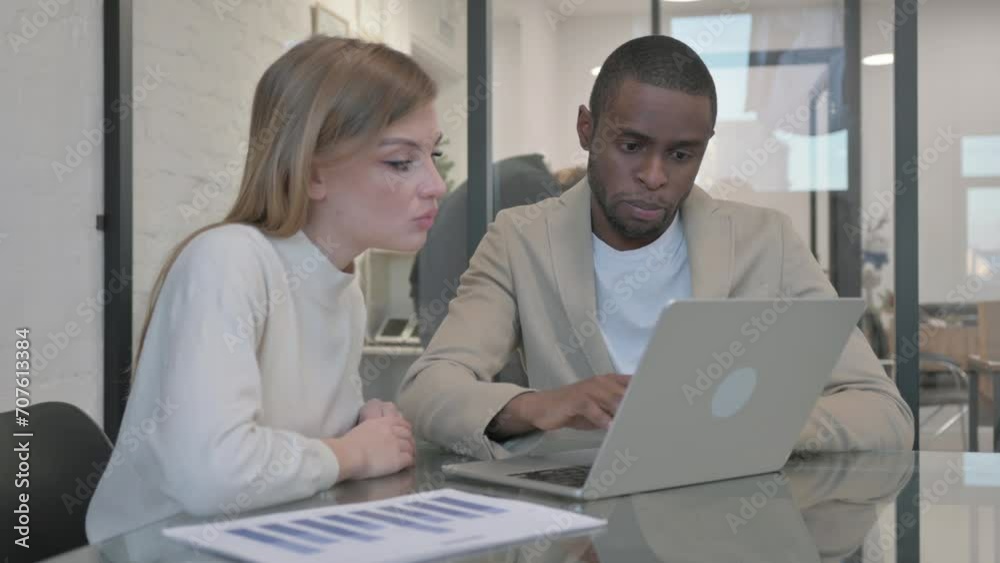 Mixed Race People Working on Laptop in Office Mixed Race People Working on Laptop in Office