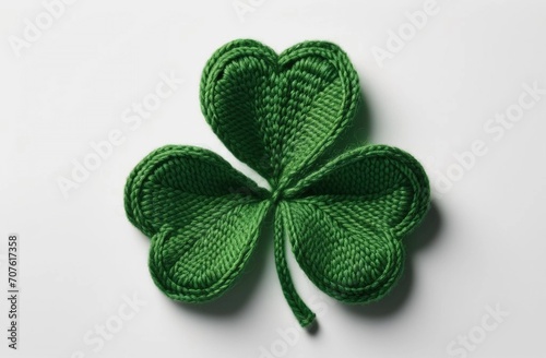 Knitted green four leaf clover isolated