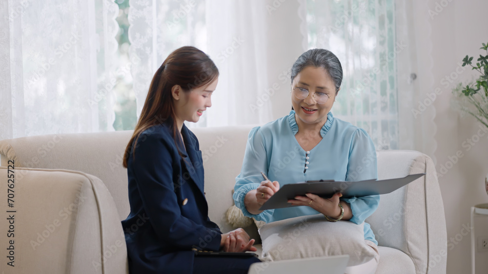 custom made wallpaper toronto digitalfemale realtor make property offer for sale to elderly spouses old customers contract on table,buy new home,take bank loan or medical health insurance concept.Financial advisor,realtor agent,insurance