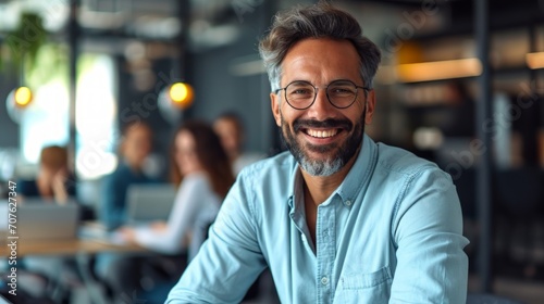 Photo concept of a man in a professional office environment, smiling warmly while engaging in a discussion with colleagues Generative AI