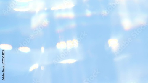 Blue abstract smooth bokeh light leak, water blurred motion, sunlight lens flare photo