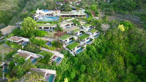 Aerial View of Group of Private Villas Nested on Hilltop in Maua Resort Nusa Penida Klungkung Regency, Bali Indonesia photo