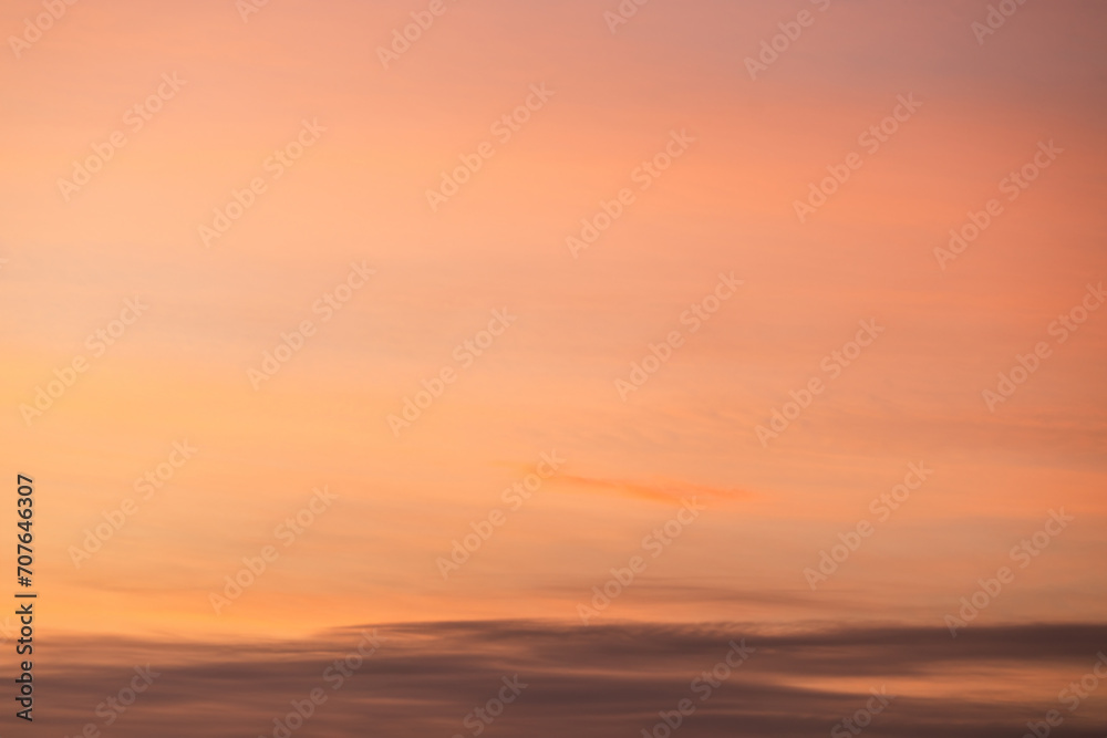 A beautiful sky tinted by the sun leaving vibrant shades of gold, pink, blue and multicolored. Clouds in the twilight evening and morning sky. Cloudy sky background in the evening and during the day. A beautiful sky tinted by the sun leaving vibrant shades of gold, pink, blue and multicolored. Clouds in the twilight evening and morning sky. Cloudy sky background in the evening and during the day.