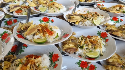 Stack of plates chicken Soto or Soto Ayam in Indonesia  traditional hot chicken soup. Soto ayam is a traditional Indonesian dish which uses ingredients such as chicken  vermicelli and bean sprout