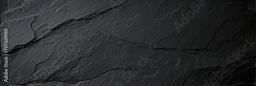 Dark grey black slate texture background. Black stone texture. Black granite slabs background 