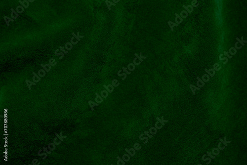 Green velvet fabric texture used as background. Emerald color panne fabric background of soft and smooth textile material. crushed velvet .luxury emerald tone for silk...