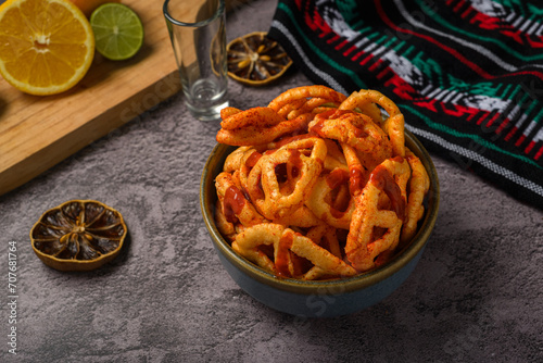 Fried Mexican wheat chips with hot sauce. Duritos, typical Mexican snack. photo