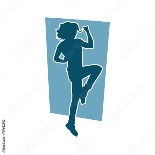 Silhouette of a female dancer in action pose. Silhouette of a woman dancing happily.