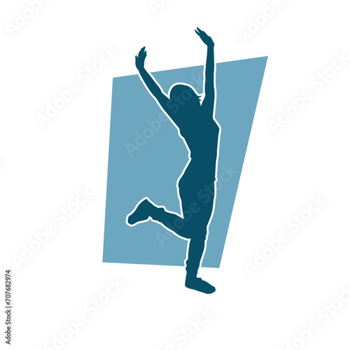 Silhouette of a female dancer in action pose. Silhouette of a woman dancing happily.