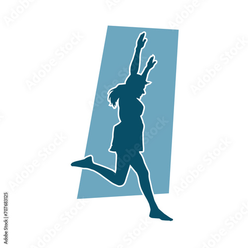 Silhouette of a female dancer in action pose. Silhouette of a woman dancing happily.