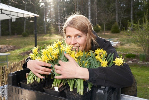 woman with flowers smiling