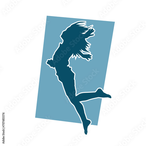 Silhouette of a female dancer in action pose. Silhouette of a woman dancing happily.