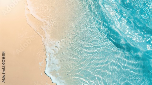 sand beach from above with light blue transparent water wave and sun lights, summer vacation background concept banner with copy space, natural beauty spa outdoors.