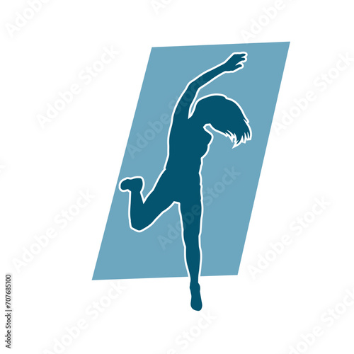 Silhouette of a female dancer in action pose. Silhouette of a woman dancing happily.