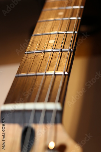 Vertical background with guitar neck with strings