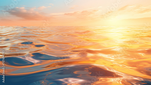 Calm ocean surface reflecting golden light at sunrise